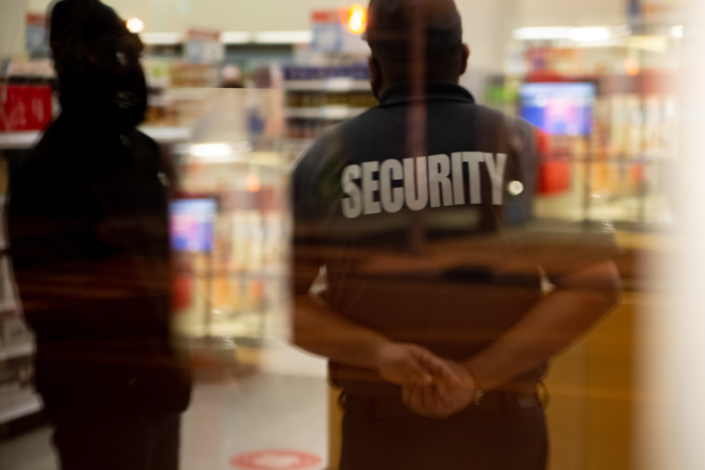 Executive protection officers standing inside a building