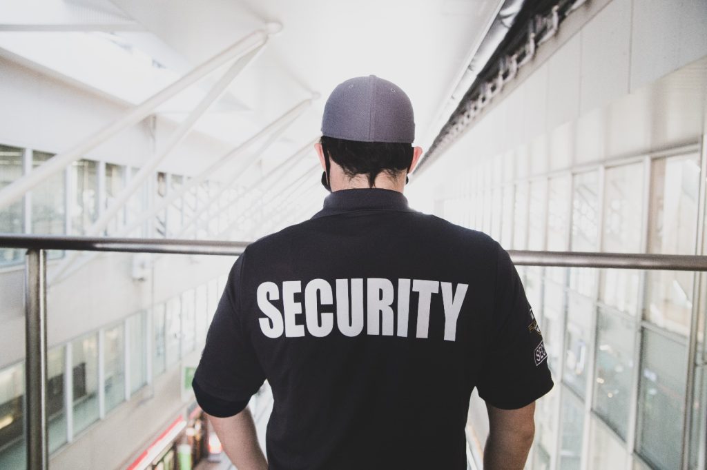 Security guard standing on a balcony