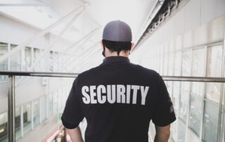 Security guard standing on a balcony