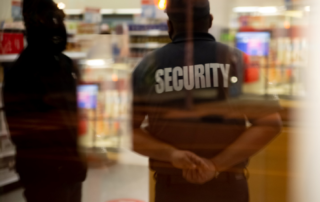 A blurry image of a security guard