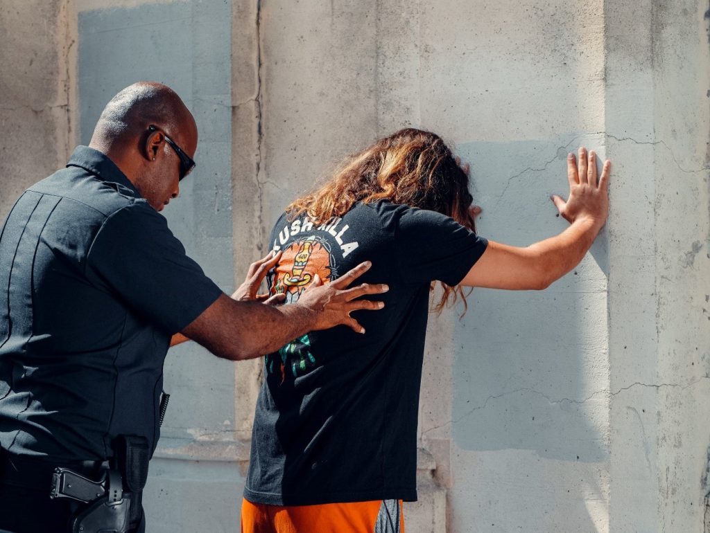 A thief getting caught by a security guard