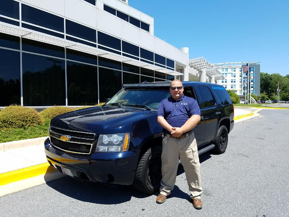 An on-site security guard with a car