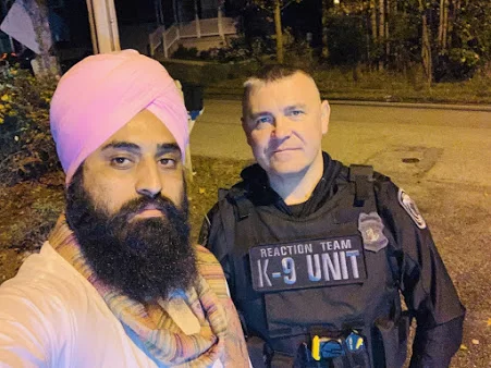 A person posing with a security officer