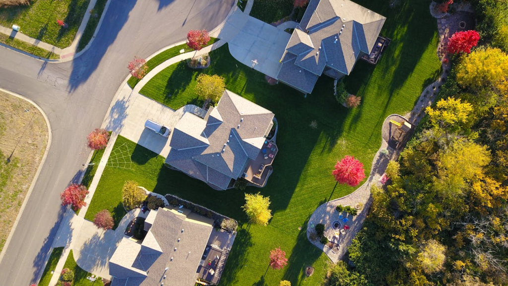 An image of an aerial view of a home in a gated community