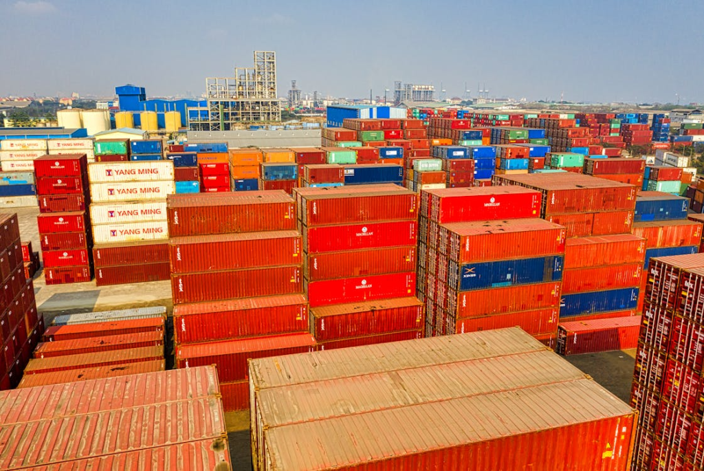 A large number of containers are stacked together.