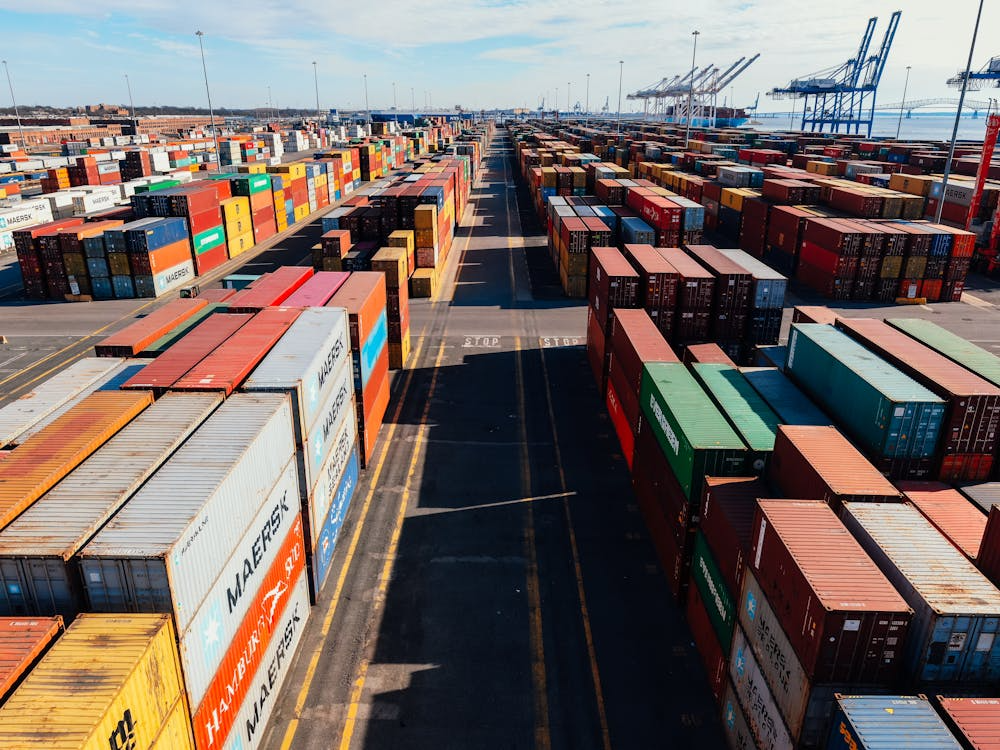 A large number of containers are lined up on a road.