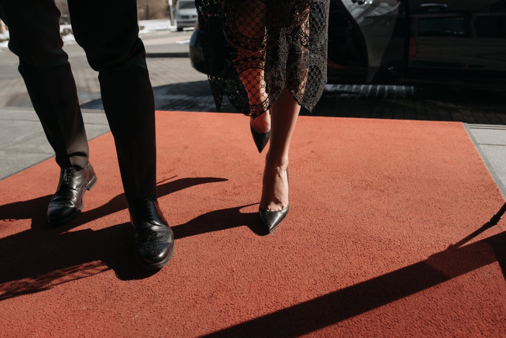People walking on a red carpet