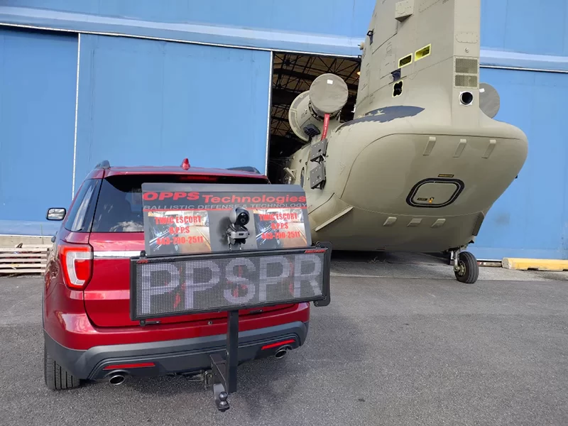 A red car with a license plate that says PPSPR.