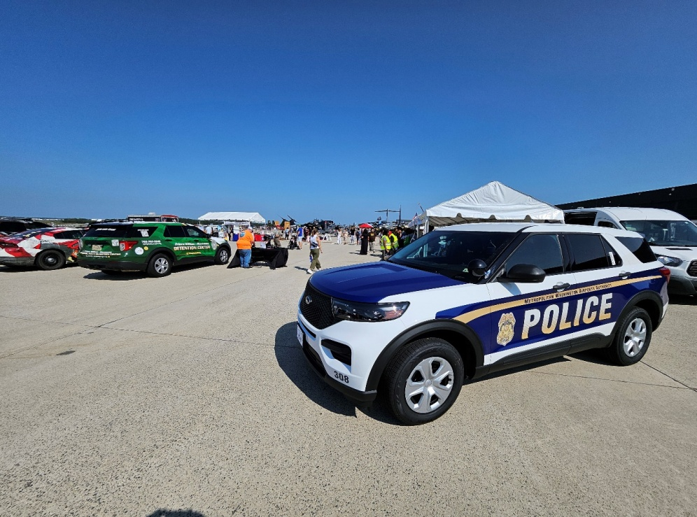 A police car parked in a parking lot.