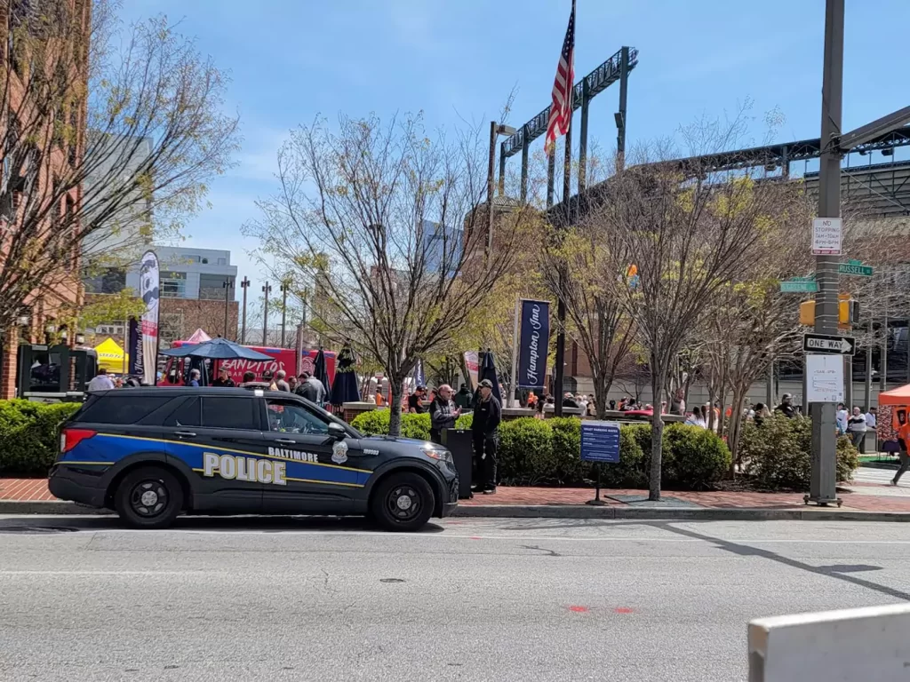 A police car parked on the side of a road.