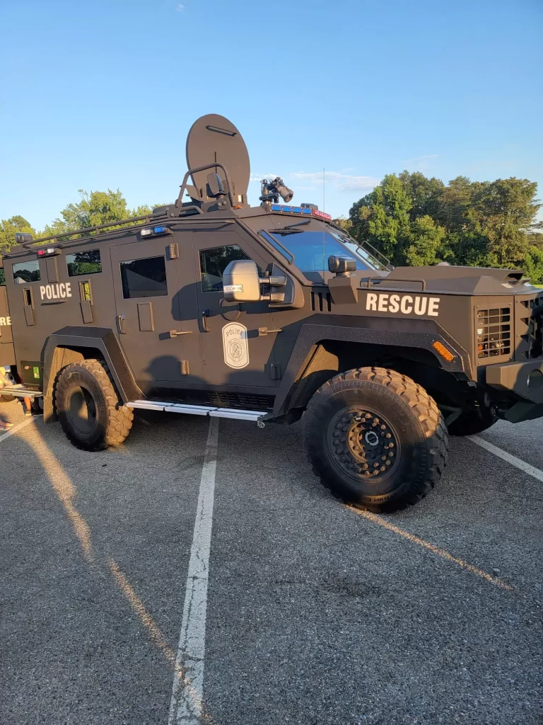 A police truck is parked on the street.